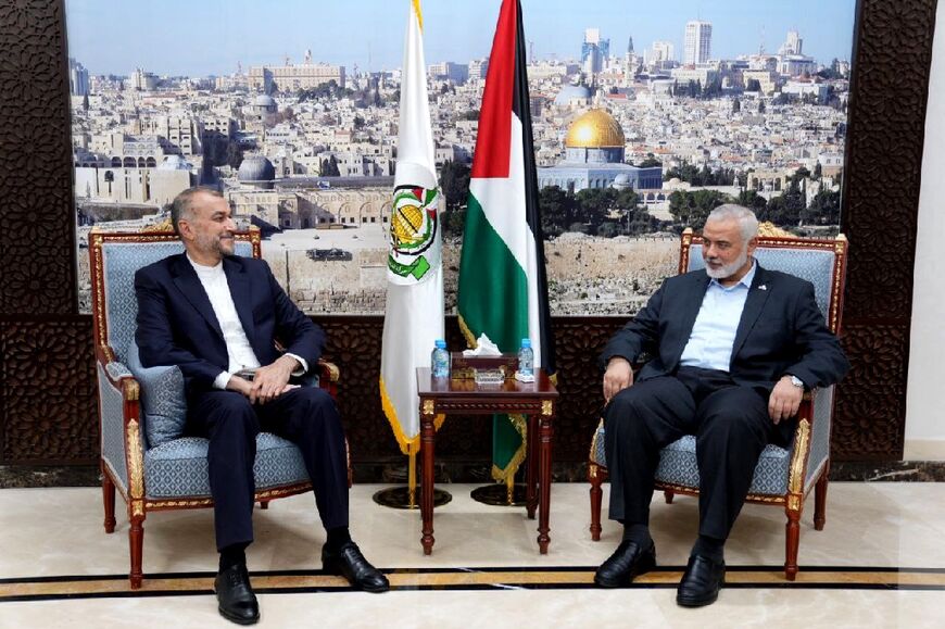 Haniyeh (R) holds talks with Iranian Foreign Minister Hossein Amir-Abdollahian in Doha on October 14