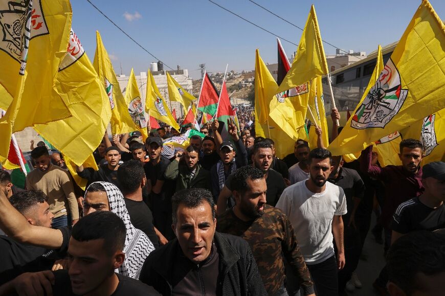 Mourners hold a funeral procession for Palestinian teenager Munes Ziyadat, who was killed by Israeli fire in the West Bank village of Bani Naim