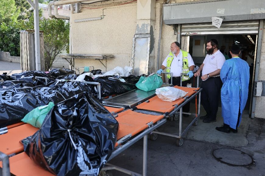 Bodies are lain in thick black plastic bags and numbered before delivery to the centre for identification