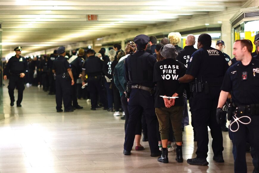 NYPD officers arrested hundreds of protesters during a demonstration calling for a ceasefire in the Israel-Hamas war, at Grand Central station in New York City