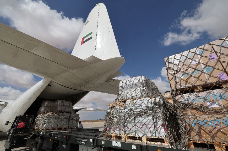 Thousands of tonnes of aid has begun arriving on the Egyptian side of the border