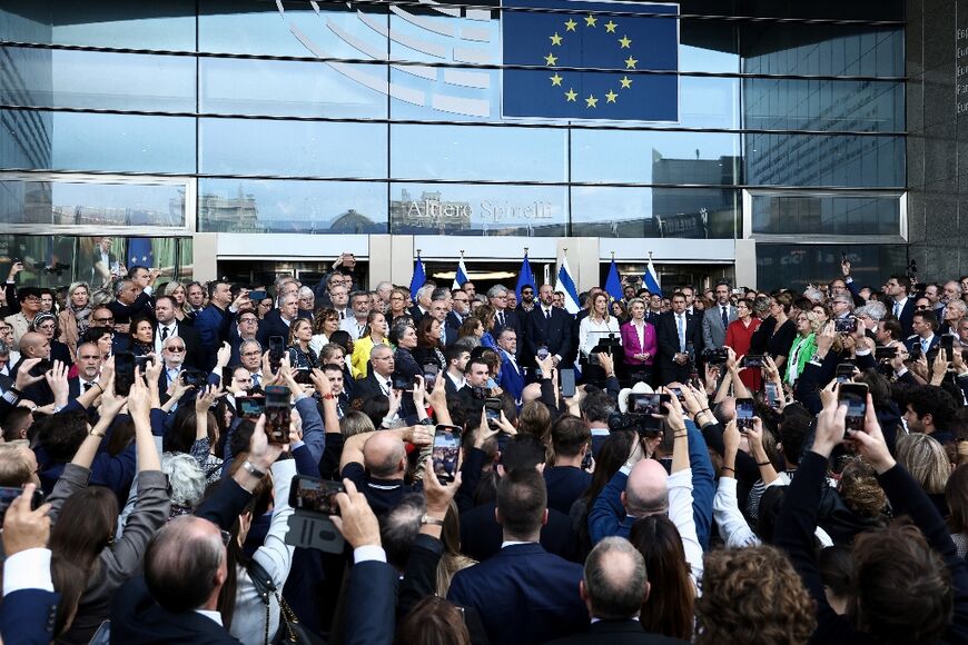 EU leaders attend a  minute's silence in front of the European Parliament in Brussels for Israelis killed in the Hamas assault