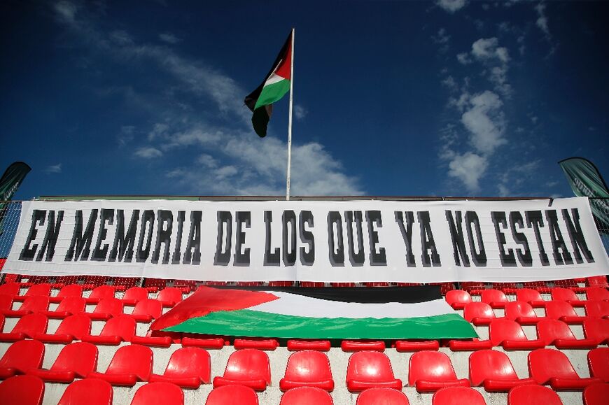 A banner displayed on the stands at the La Cisterna municipal stadium in Santiago reads "In memory of those who are no longer with us" 