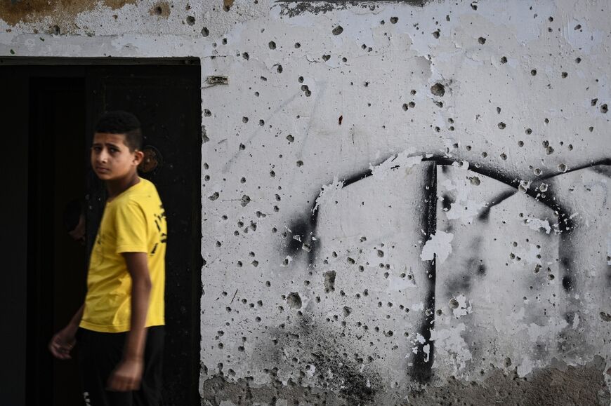 Walls in the Jenin camp bear the scars of constant conflict