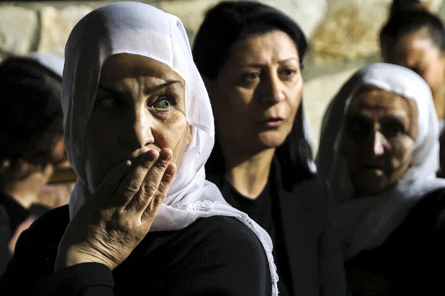 Residents of the Druze village of Yanuh-Jat attend a vigil in memory of Alim Saad, an Israeli soldier killed on the Lebanese border