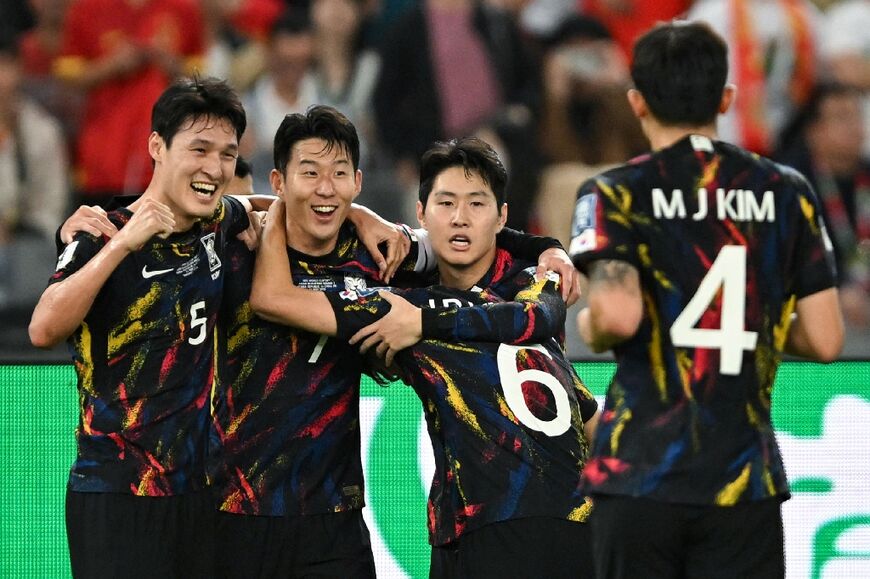 South Korea's Son Heung-min (2L) celebrates with his teammates after scoring against China at Shenzhen