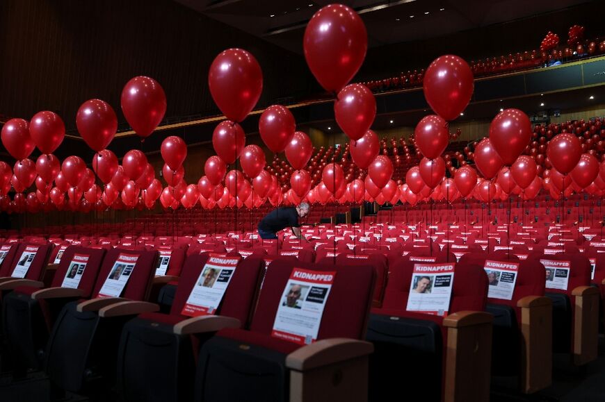 Balloons mark each of the hostages held by Hamas since the October 7 attack, in the auditorium of the Jerusalem Convention Centre on November 2, 2023