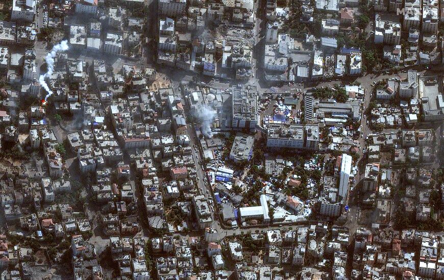 This handout satellite picture released by Maxar Technologies on November 12, 2023, shows the damage arround the Shifa Hospital in Gaza City