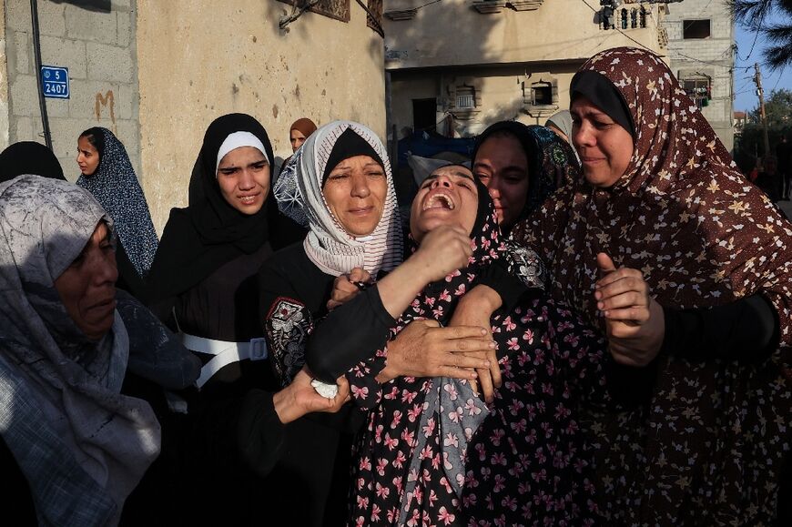 Women react during a funeral in the southern Gaza Strip