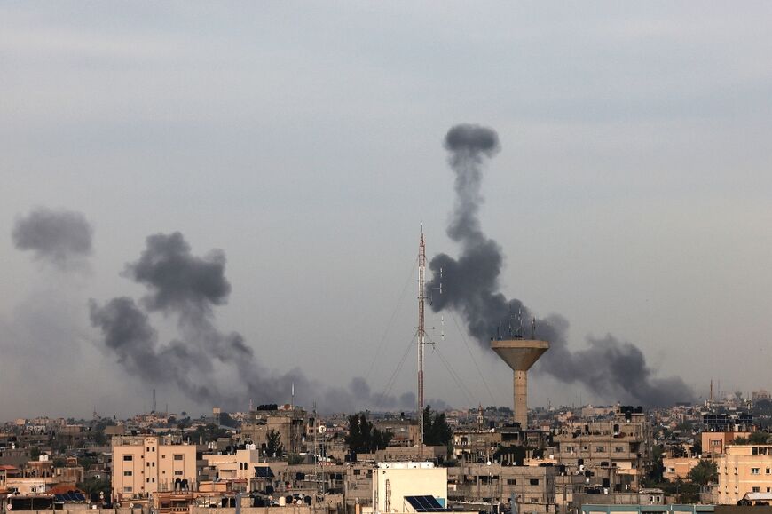 A picture taken from Rafah shows smoke billows after an Israeli strike south of Gaza City