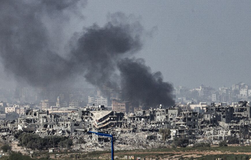 This picture taken from the Israeli side of the border with the Gaza Strip, shows Israeli bombardment of the northern Gaza Strip 