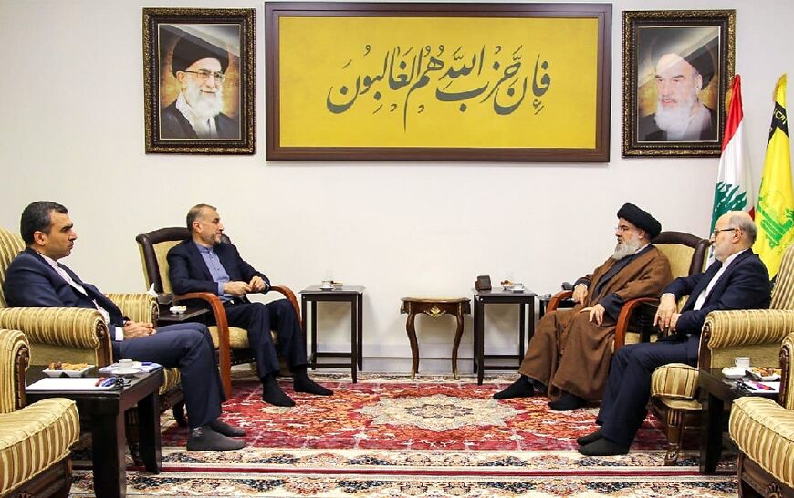 Hezbollah chief Hassan Nasrallah, second from the right, meets Iran's Foreign Minister Hossein Amir-Abdollahian, second from left, at an undisclosed location in Lebanon in an image provided by Hezbollah's media office 
