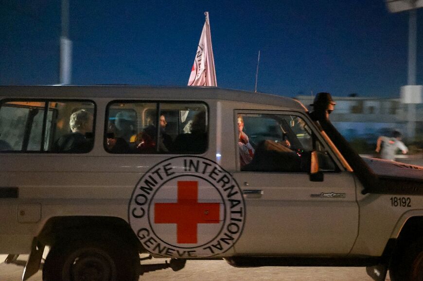 A vehicle of the International Committee of the Red Cross reportedly carrying Israeli hostages released by Hamas passes through the Rafah border crossing from Gaza to Egypt