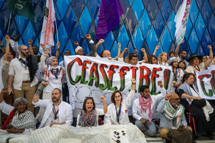 The activists chant slogans demanding a ceasefire in the Israel-Hamas war
