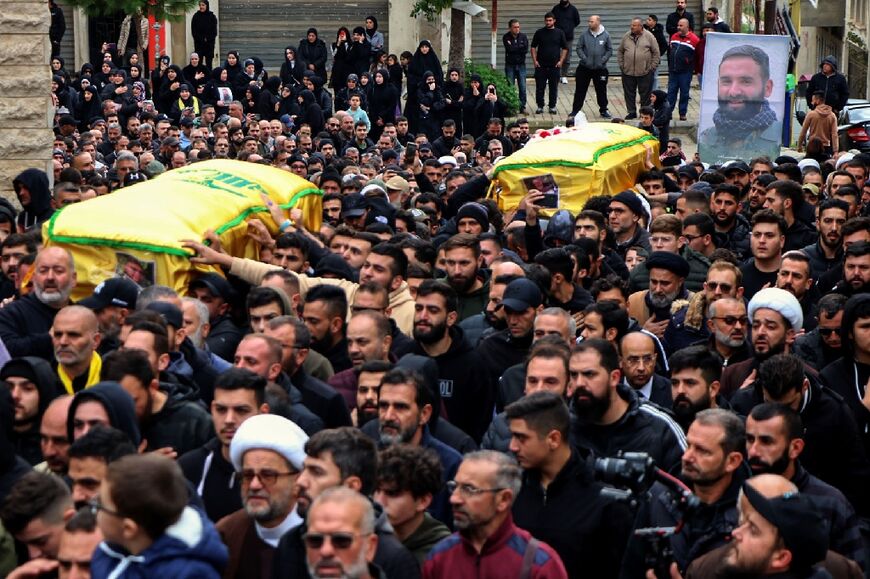 Mourners carry the coffin of a Hezbollah fighter killed in an Israeli strike on south Lebanon