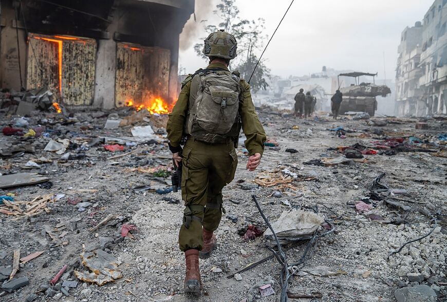 Israeli soldiers operate in the Gaza Strip, in a picture released by the army on December 22, 2023 