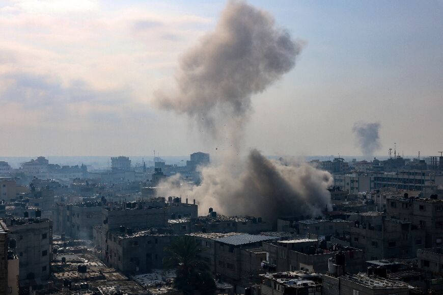 A plume of smoke rises during an Israeli strike on the Rafah refugee camp in southern Gaza