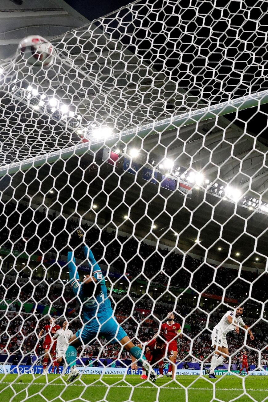 Indonesia's goalkeeper  Ernando Ari concedes a third goal 