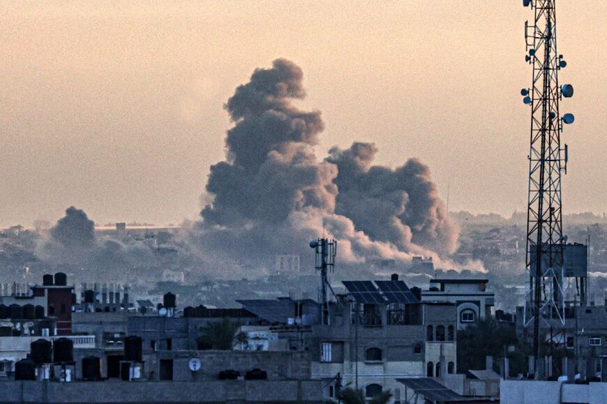 Smoke billowing over Khan Yunis in the southern Gaza Strip, ravaged by 100 days of war