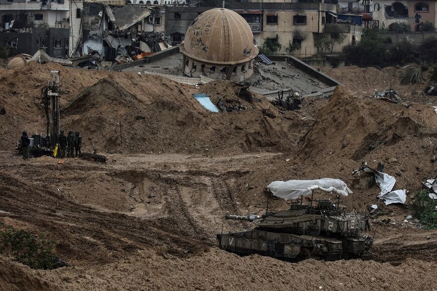 This picture taken during a media tour organised by the Israeli military on January 27, 2024 shows an Israeli army tank rolling in Gaza's main southern city of Khan Yunis, amid continuing battles between Israel and Palestinian militant group Hamas