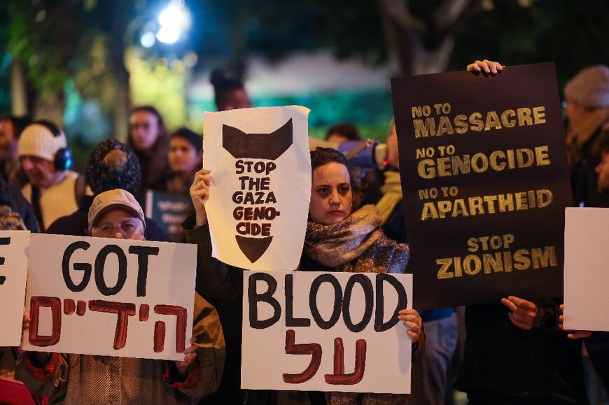 Israeli left-wing activists at a rally against the war in Gaza, near the defence ministry in central Tel Aviv