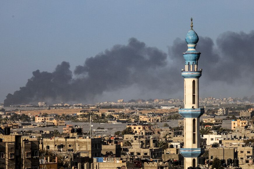 Smoke billows over Khan Yunis in the southern Gaza Strip during Israeli bombardment on January 22, 2024