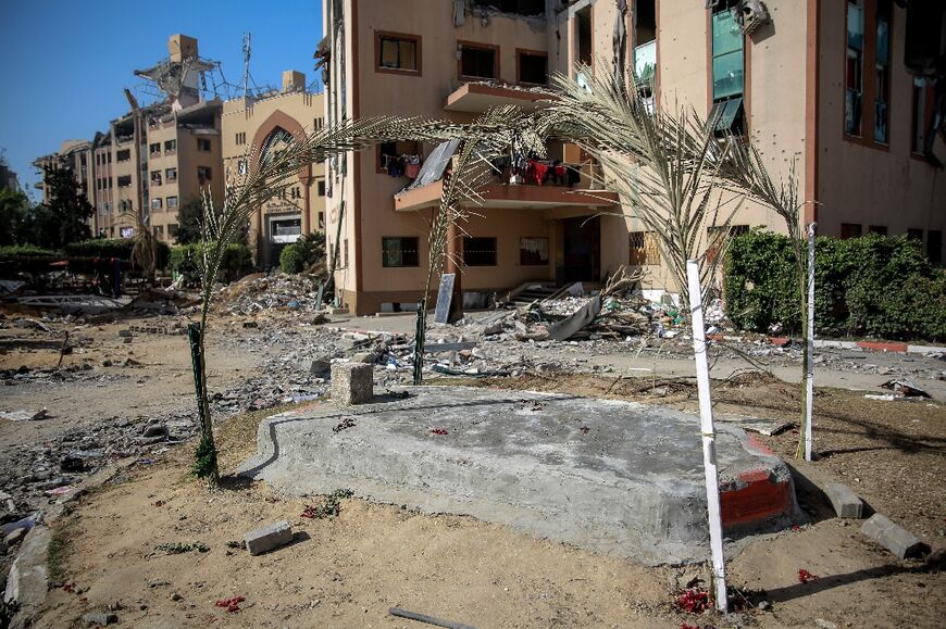 The grave of a Palestinian killed in Israeli bombing lies in the middle of the Islamic University's campus in Gaza City