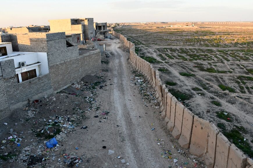The wall hems in Samarra and the city's surging population