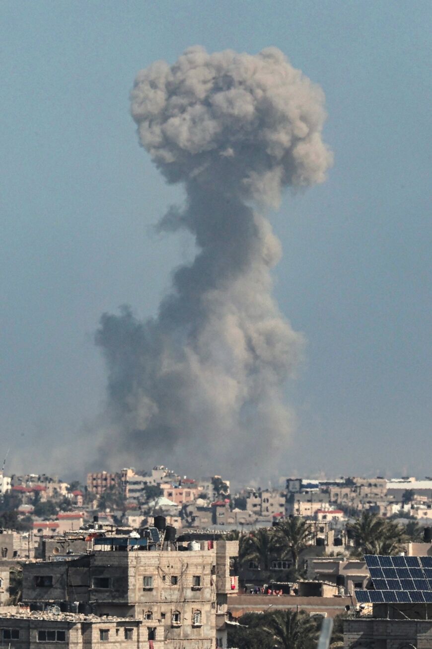 Smoke billows over Khan Yunis in the southern Gaza Strip during Israeli bombardment on February 21, 2024, amid continuing battles between Israel and the Palestinian militant group Hamas