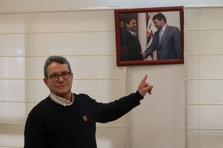 Mayor Jaber with a picture of him shaking hands with Jordan's King Abdullah II