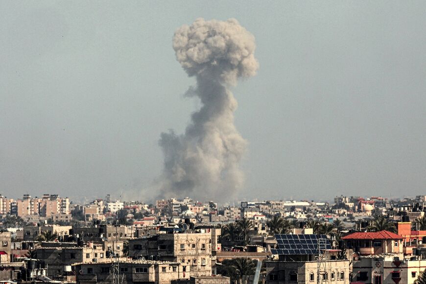Smoke billows over Khan Yunis in the southern Gaza Strip during Israeli bombardment on February 21, 2024