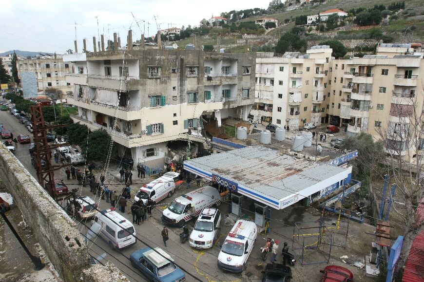Rescuers gather outside a building targeted in an Israeli strike on the southern Lebanese city of Nabatieh