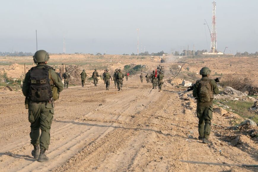 Israeli soldiers patrol an unspecified location in the Gaza Strip