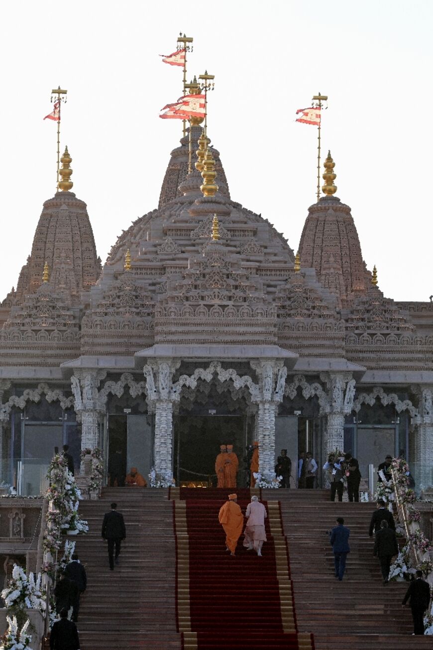 Modi walks up to the entrance of the new temple