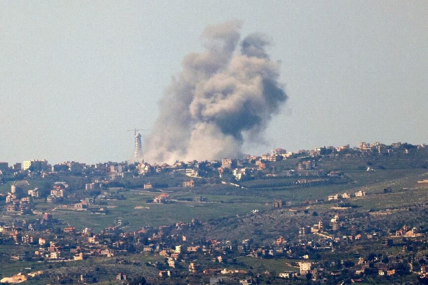 This picture taken from northern Israel shows smoke billowing above the Lebanese village of Bint Jbeil during Israeli bombardment on February 28, 2024
