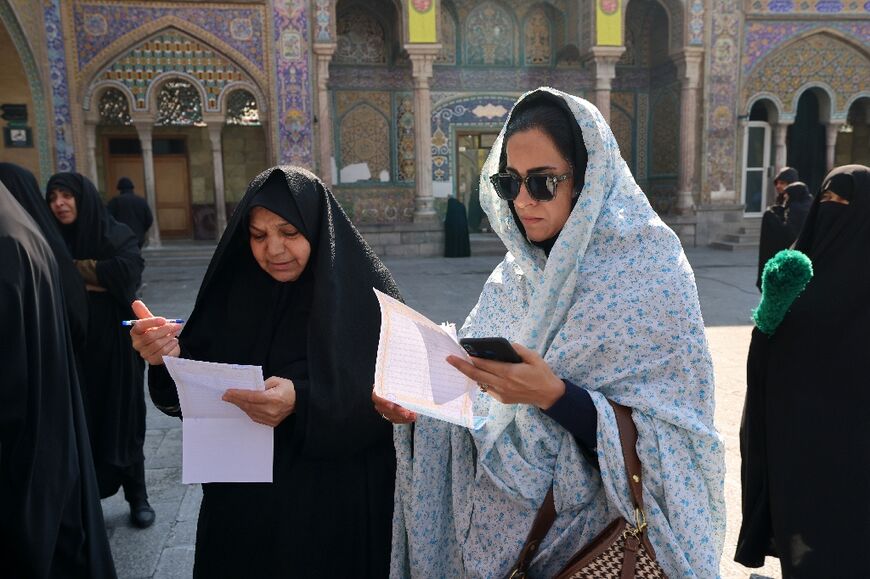 Iranians Vote In Elections As Conservatives Expected To Dominate - Al ...