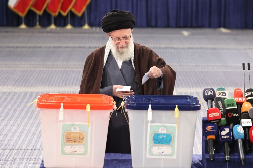 Iran's supreme leader Ayatollah Ali Khamenei cast his ballots during the parliamentary and key clerical body elections 