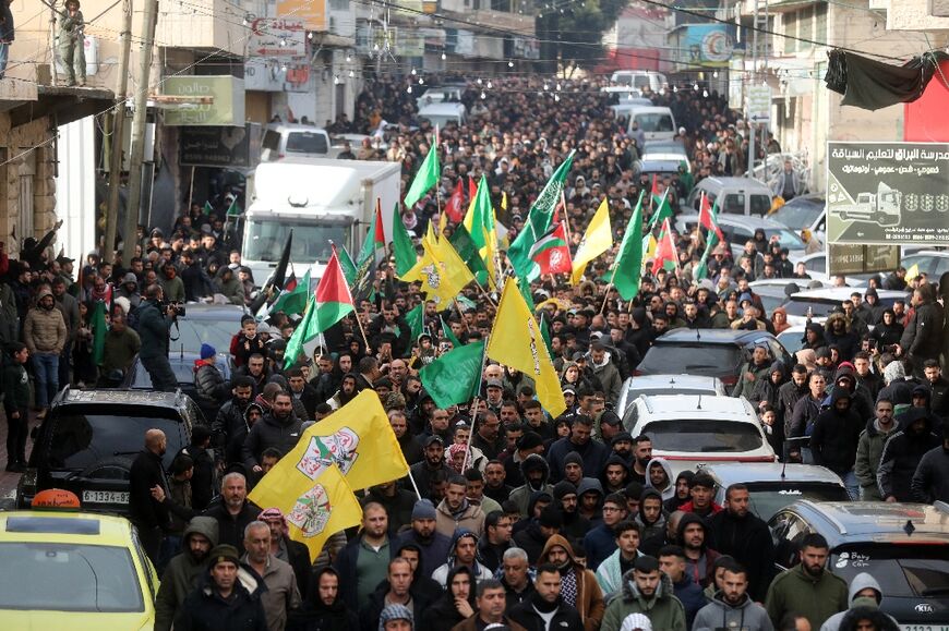The funeral procession on January 29, 2024 for Palestinians Moataz Atbeish and Muhannad al-Fasfus who died of wounds following an Israeli raid in Dura 