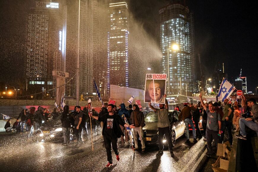 Water cannon is fired at anti-government protesters in Tel Aviv