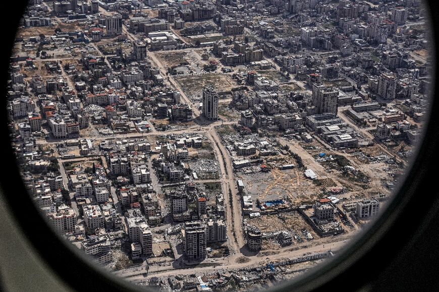 The Star of David is etched in an empty lot surrounded by destroyed buildings in the Gaza Strip, as seen from the porthole of the US Air Force 26th Expeditionary Rescue Squadron HC-130J aircraft