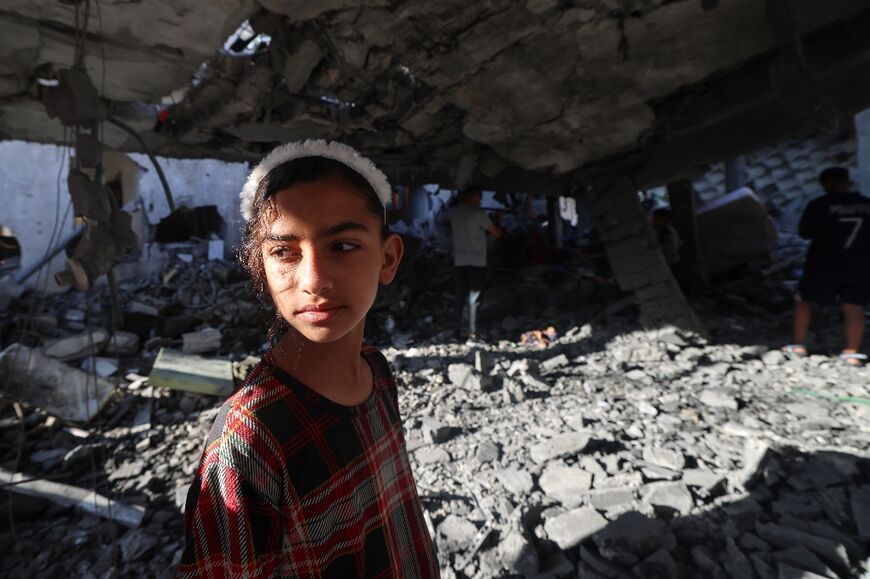A child look on after an Israeli bombardment of the southernmost Gaza city of Rafah, where 1.5 million Palestinians are sheltering