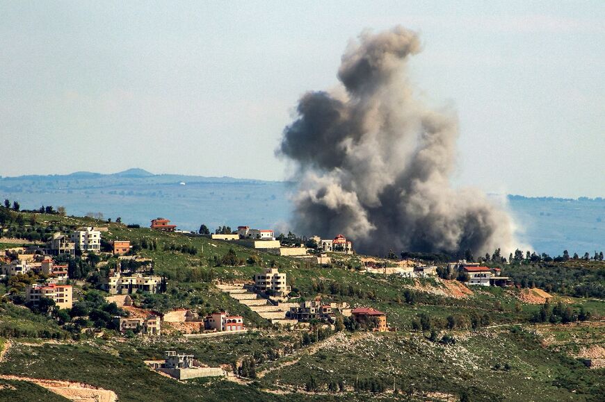 Smoke billows from the area of an Israeli air strike on the southern Lebanese village of Khiam near the border with Israel on April 8, 2024