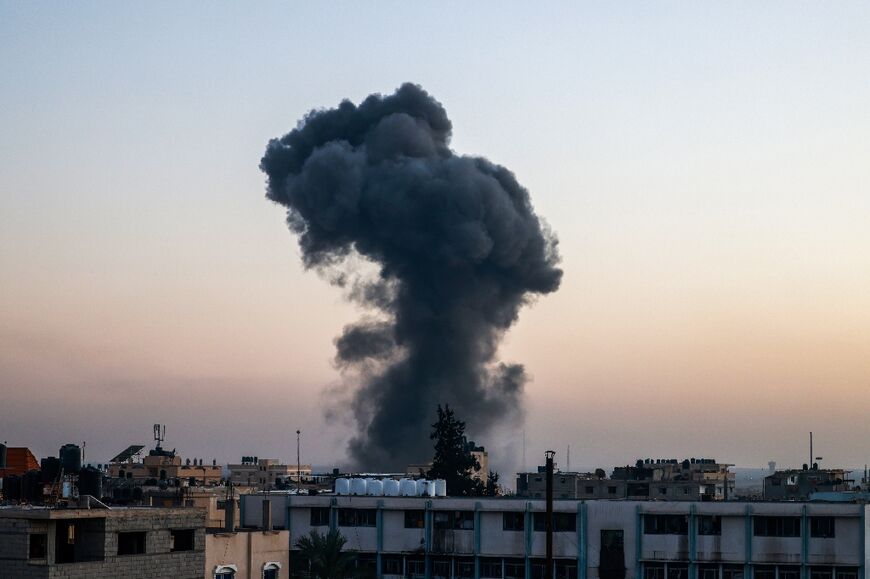 Smoke billows over buildings after an Israeli strike in Rafah on April 4, 2024 