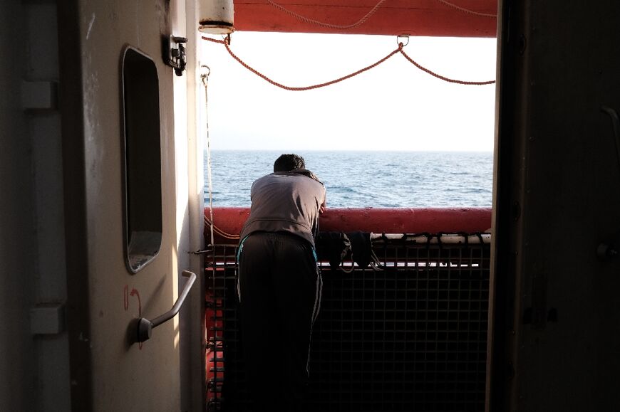 A Bangladeshi migrant watching teh sunset on the Ocean Viking deck on May 21, 2024