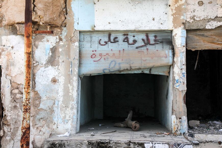 A shop damaged during the 2014 attack by Islamic State and the battles that followed, in the town of Sinjar in the northern Iraqi Nineveh province
