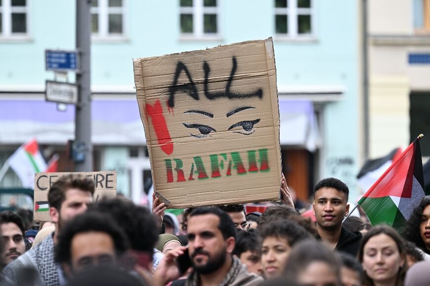 A participant holds up a placard during a pro-Palestinian protest in Berlin on May 18