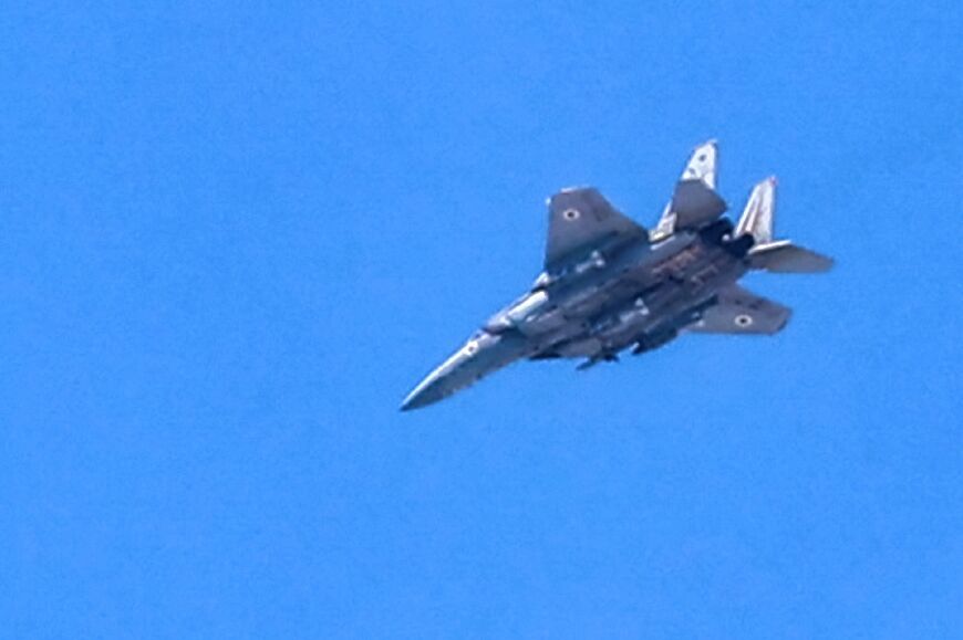 An Israeli Air Force fighter aircraft flies over Jabalia