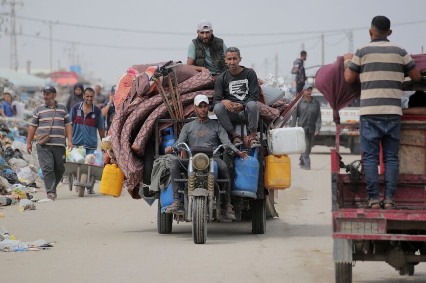 Palestinians who fled from Rafah arrive in Khan Yunis, further north