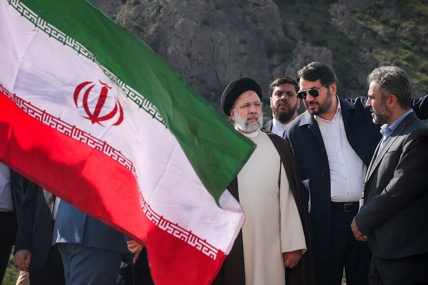 A picture provided by the Iranian presidency shows President Ebrahim Raisi at the site of Qiz Qalasi, the third dam jointly built by Iran and Azerbaijan on the Aras River