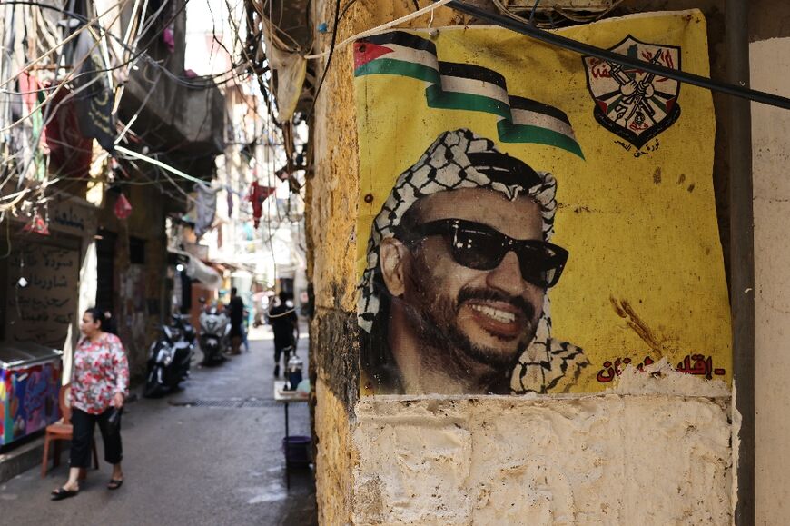 The faces of Palestinian leaders appear across the walls of the camp